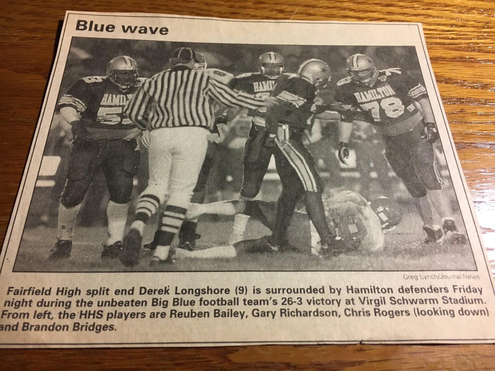 Fairfield receiver Derek Longshore is surrounded by Hamilton defenders (from left) Reuben Bailey, Gary Richardson, Chris Rogers (looking down) and Brandon Bridges during a Week 9 game at Virgil Schwarm Stadium in 1997. GREG LYNCH/STAFF