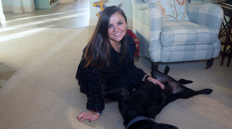 Teddy enjoys his tummy rub from Jordan. KARIN SPICER/CONTRIBUTED