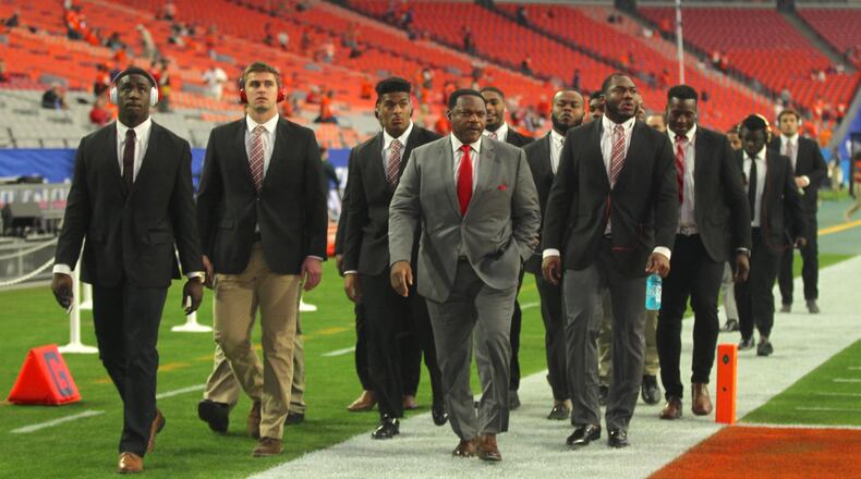 Ohio State defensive line coach Larry Johnson leads his group on a lap around the field before the Fiesta Bowl on Dec. 31, 2016, at University of Phoenix Stadium in Glendale, Ariz. David Jablonski/Staff