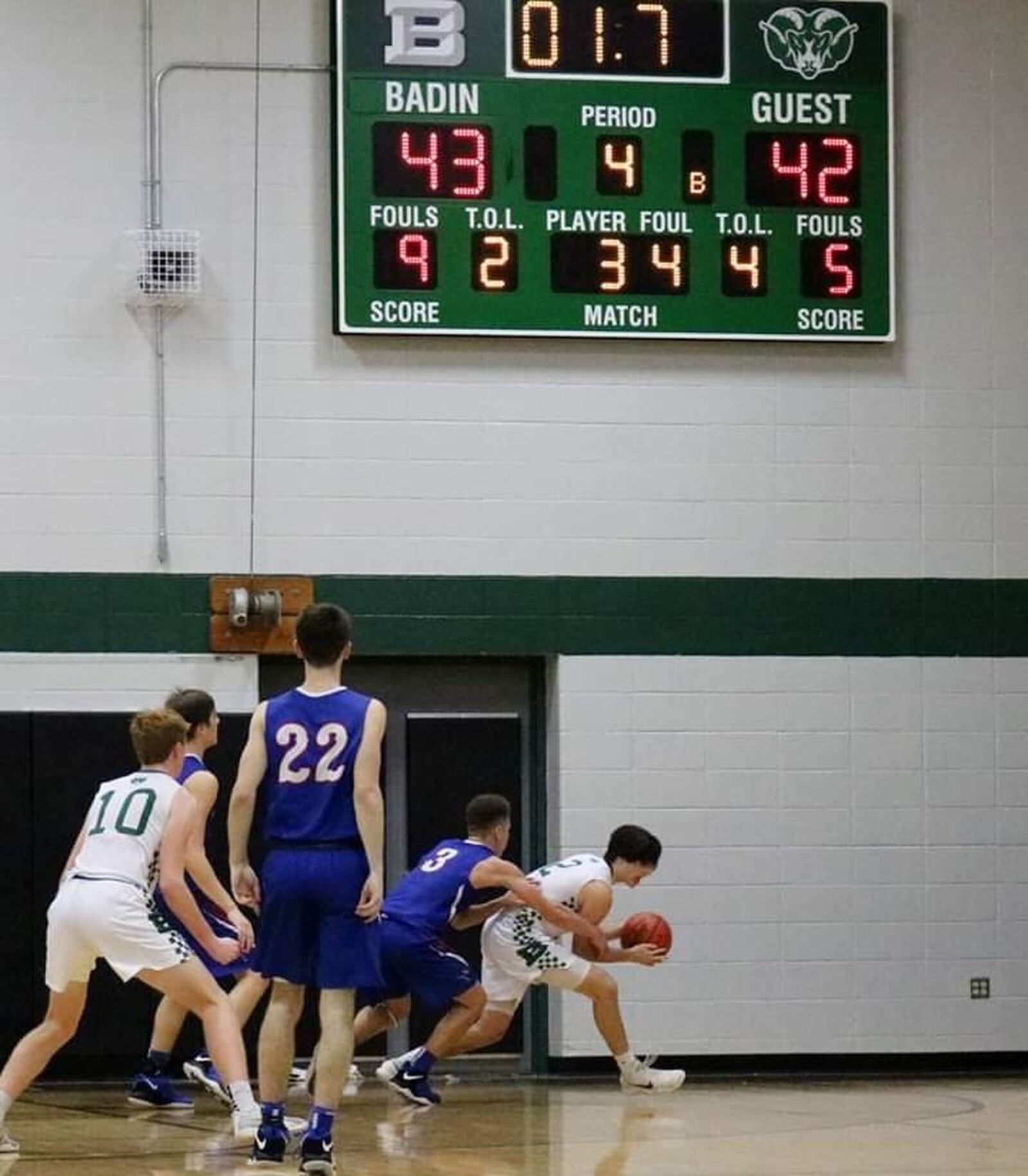 Badin’s Seth Hargis comes up with the clinching rebound in the final seconds of the Rams’ 43-42 win over Carroll on Friday night at Mulcahey Gym in Hamilton. CONTRIBUTED PHOTO BY TERRI ADAMS