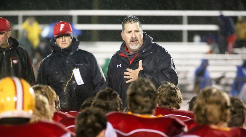 Fenwick coach Joe Snively talks to his team Nov. 28, 2015, after the Falcons lost to Columbus Hartley 26-14 in a Division IV state semifinal at Wilmington’s Alumni Field. GREG LYNCH/STAFF