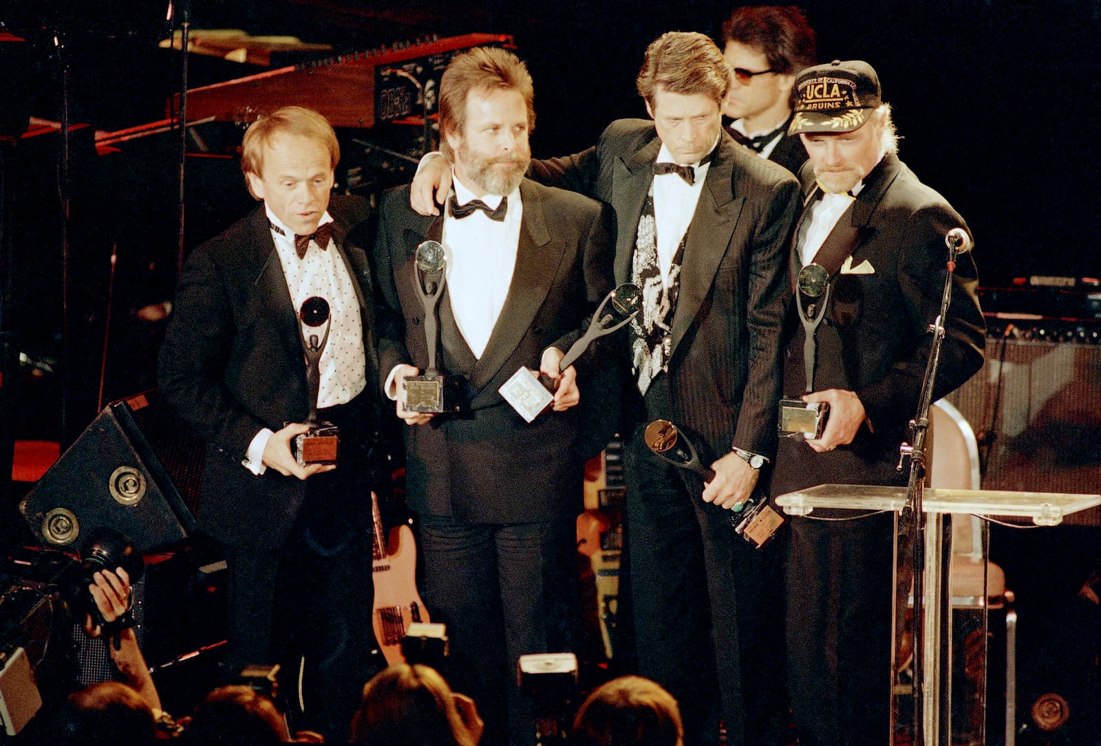 FILE - The Beach Boys, from left, Al Jardine, Carl Wilson, Brian Wilson and Mike Love, hold their trophies after being inducted into the Rock 'n' Roll Hall of Fame in New York, Jan. 21, 1988. (AP Photo/Ron Frehm, File)