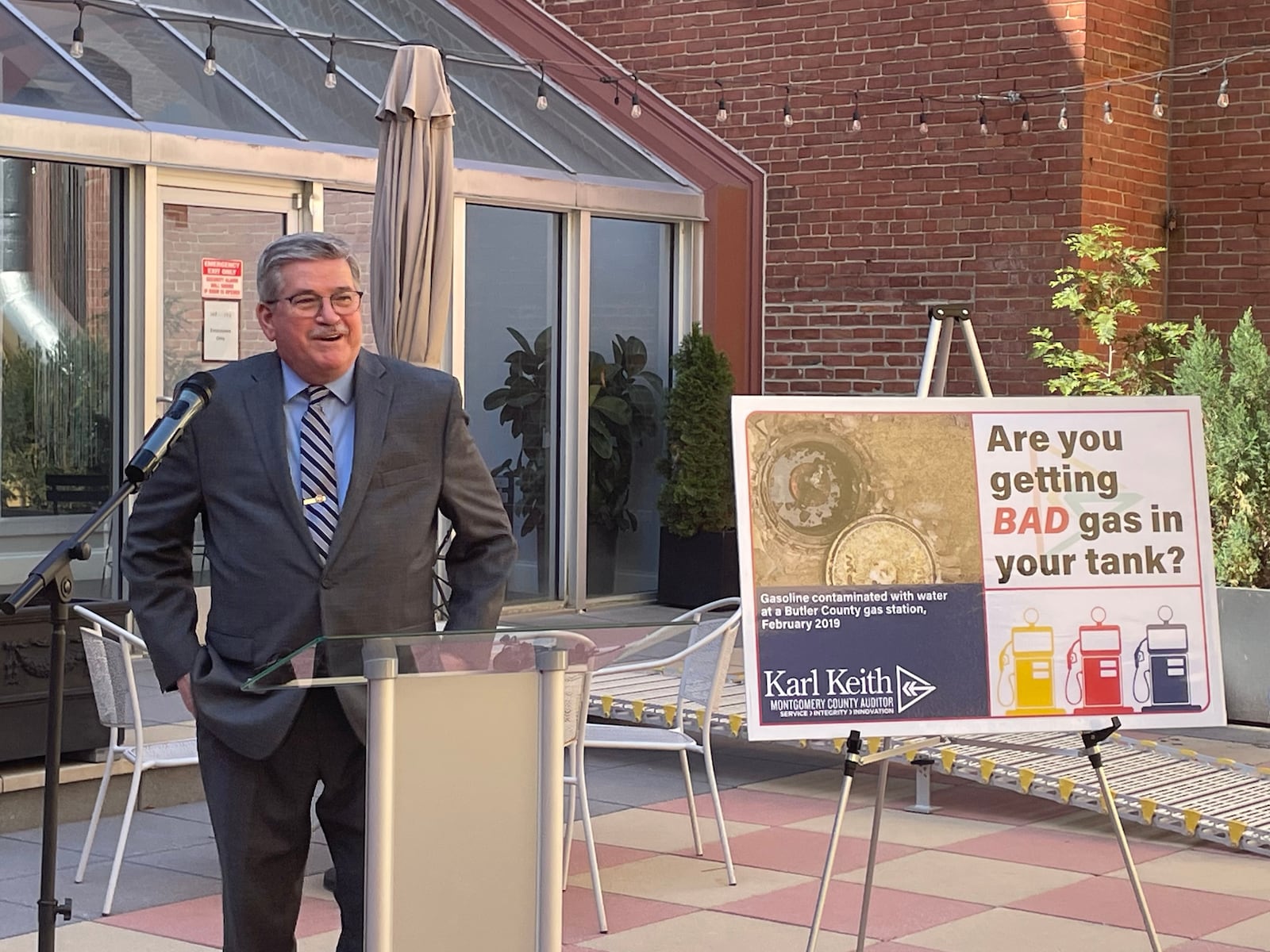 Montgomery County Auditor Karl Keith discusses the impact of contaminated fuel on motorists and businesses during a Wednesday morning press conference at the Dayton Arcade.