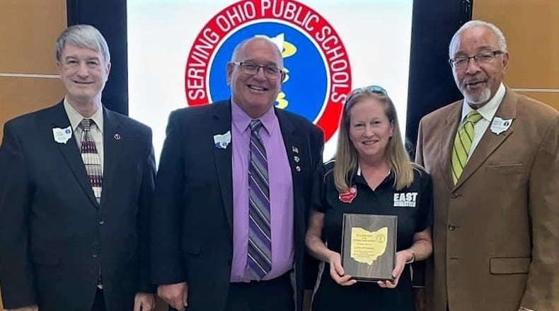 Lynda O'Connor, the most veteran member of the Lakota Board of Education, was recently awarded the Ohio School Boards Association's (OSBA) "All-Ohio School Board Award" as one of only five members out of thousands serving on local school boards statewide. O'Connor, who joined Lakota's board in 2008, is the first from the district's governing board to win the statewide honor since 1994. Pictured is O'Connor with OSBA officials in Columbus. (Provided Photo\Journal-News)