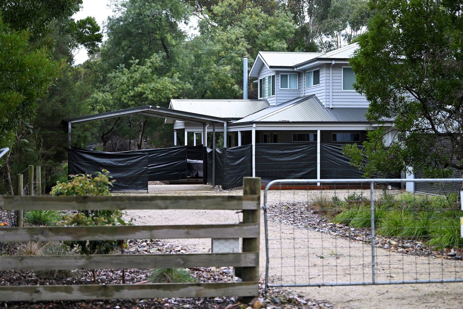 Black plastic surrounds the exterior of the Leongatha home on July 1, 2025, where Erin Patterson allegedly served up a meal with death cap mushrooms in July 2023, in Leongatha, Australia. (James Ross/AAP Image via AP)