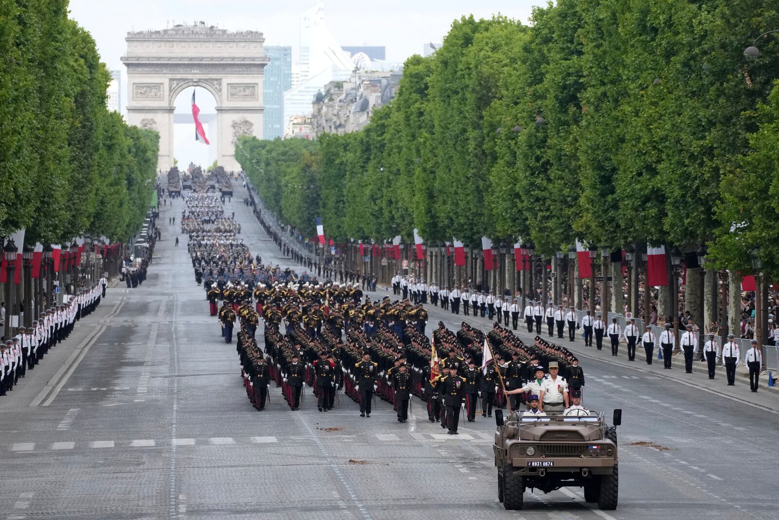 French troops march on the Champs-Elysees avenue during the Bastille Day parade, Monday, July 14, 2025 in Paris. (AP Photo/Christophe Ena)