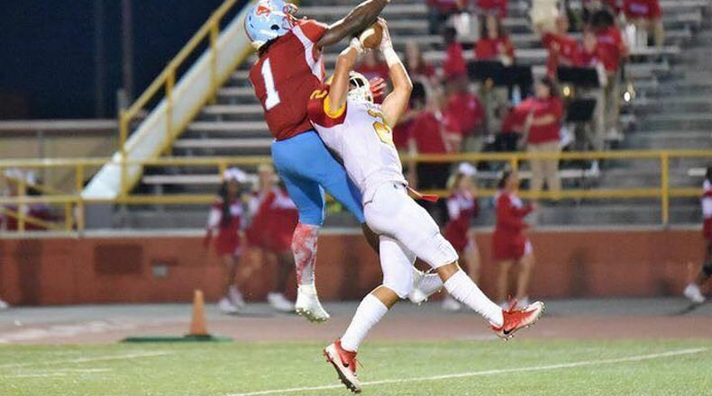 Fenwick’s R.J. Clesceri (2) goes up for a catch during last Friday night’s 30-16 victory over Belmont at Welcome Stadium in Dayton. CONTRIBUTED PHOTO BY ANGIE MOHRHAUS