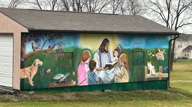 This 30-foot mural on Monroe United Methodist Church garage sparks message of hope. RICK McCRABB/CONTRIBUTOR