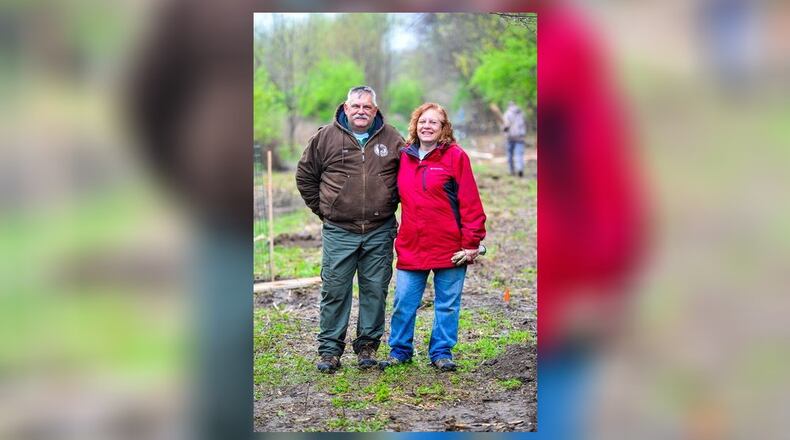 Troy and Kathy Schwable with Hamilton Conservation Corps. were named Hamilton’s Volunteers of the Year last week. Here, they stand in a clearing where 100 trees are being planted by volunteers, members of Hamilton Conservation Corps. and Hamilton city employees at Riverside Natural Area.