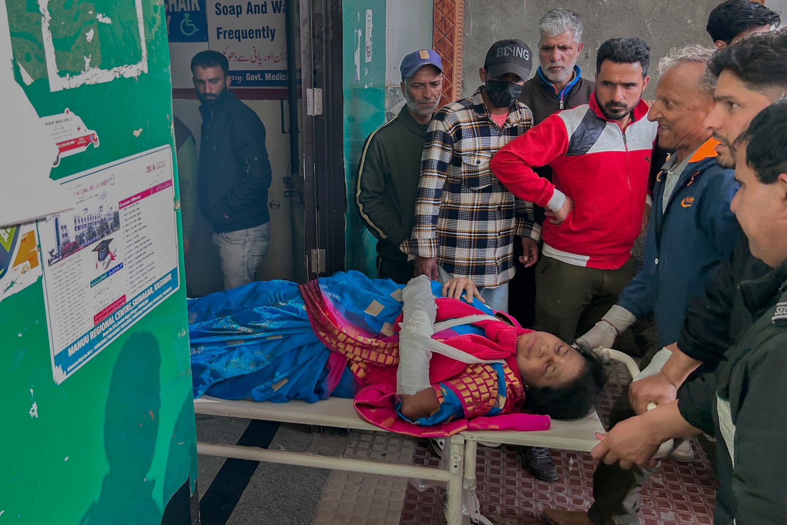 FILE - Paramedics carry a wounded tourist on a stretcher at a hospital in Anantnag after a militant attack at Pahalgam in Indian controlled Kashmir, Tuesday, April 22, 2025. (AP Photo/Dar Yasin, File)