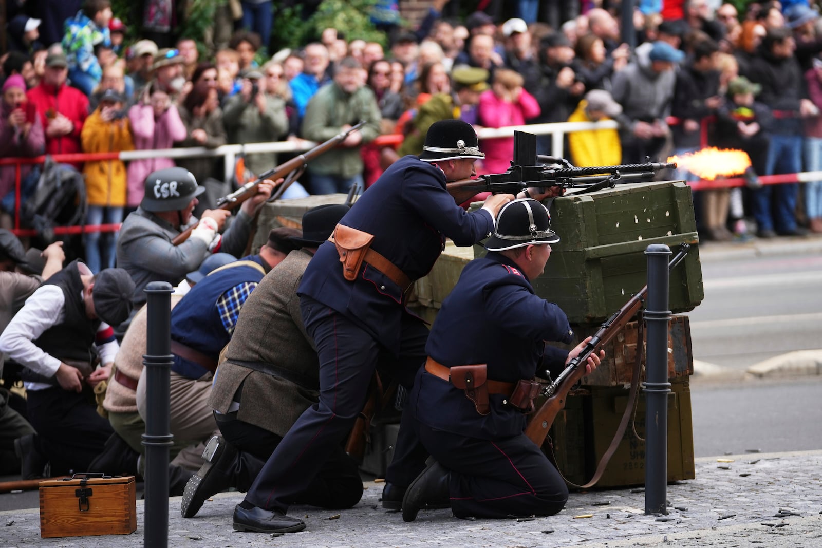 History enthusiasts take part in a reenactment of a battle, which was part of the Pragues Uprising, marking the 80th anniversary of the end of the WWII in Prague, Czech Republic, Thursday, May 8, 2025. (AP Photo/Petr David Josek)
