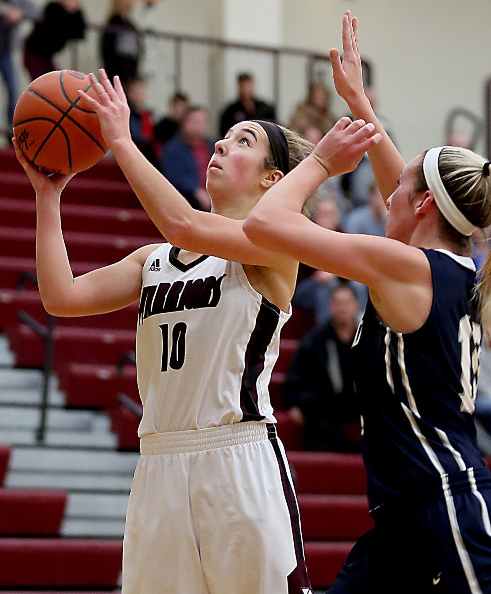 Lebanon guard Alex Warning shoots while being covered by Edgewood guard Lauren Gerber during Monday night’s game at Lebanon. CONTRIBUTED PHOTO BY E.L. HUBBARD