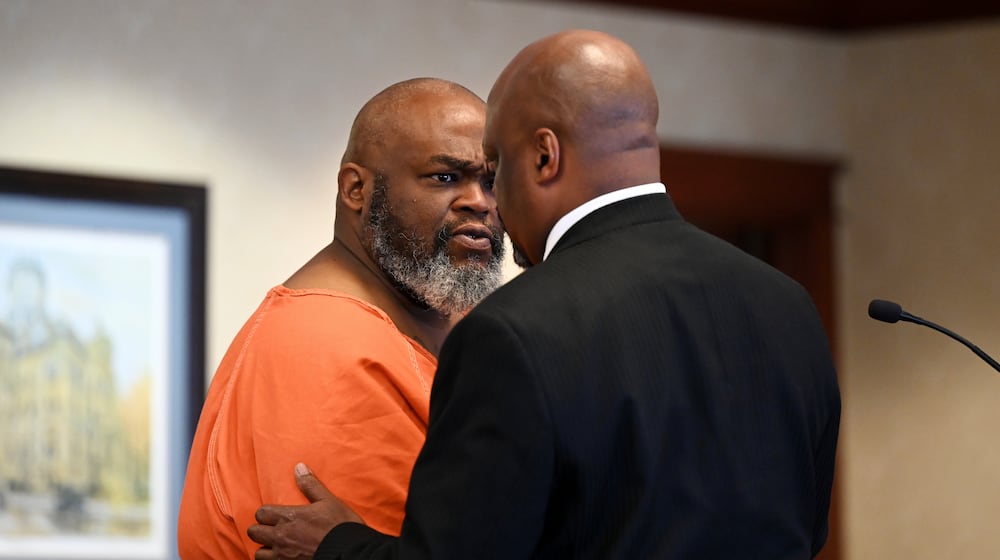 Jerome Collier, 52, of Hamilton, (pictured talking with former attorney David Washington) and Dy'Shonna Goins, 28, of Dayton, were arrested following a June 16 incident that resulted in the death of Jesse Jones, 36, of Middletown, in parking lot outside a Middletown bar. Collier is charged with several felonies, including murder, including an underlying gun specification. Both appeared in Butler County Common Pleas Court on Tuesday, July 1, 2025. MICHAEL D. PITMAN/STAFF
