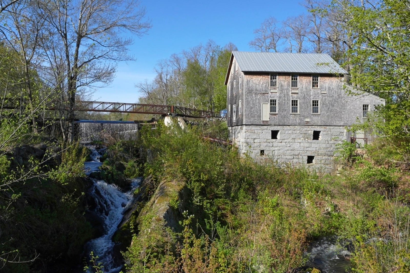 Water flows beneath a dam, Tuesday, May 13, 2025, in Freedom, Maine. (AP Photo/Robert F. Bukaty)