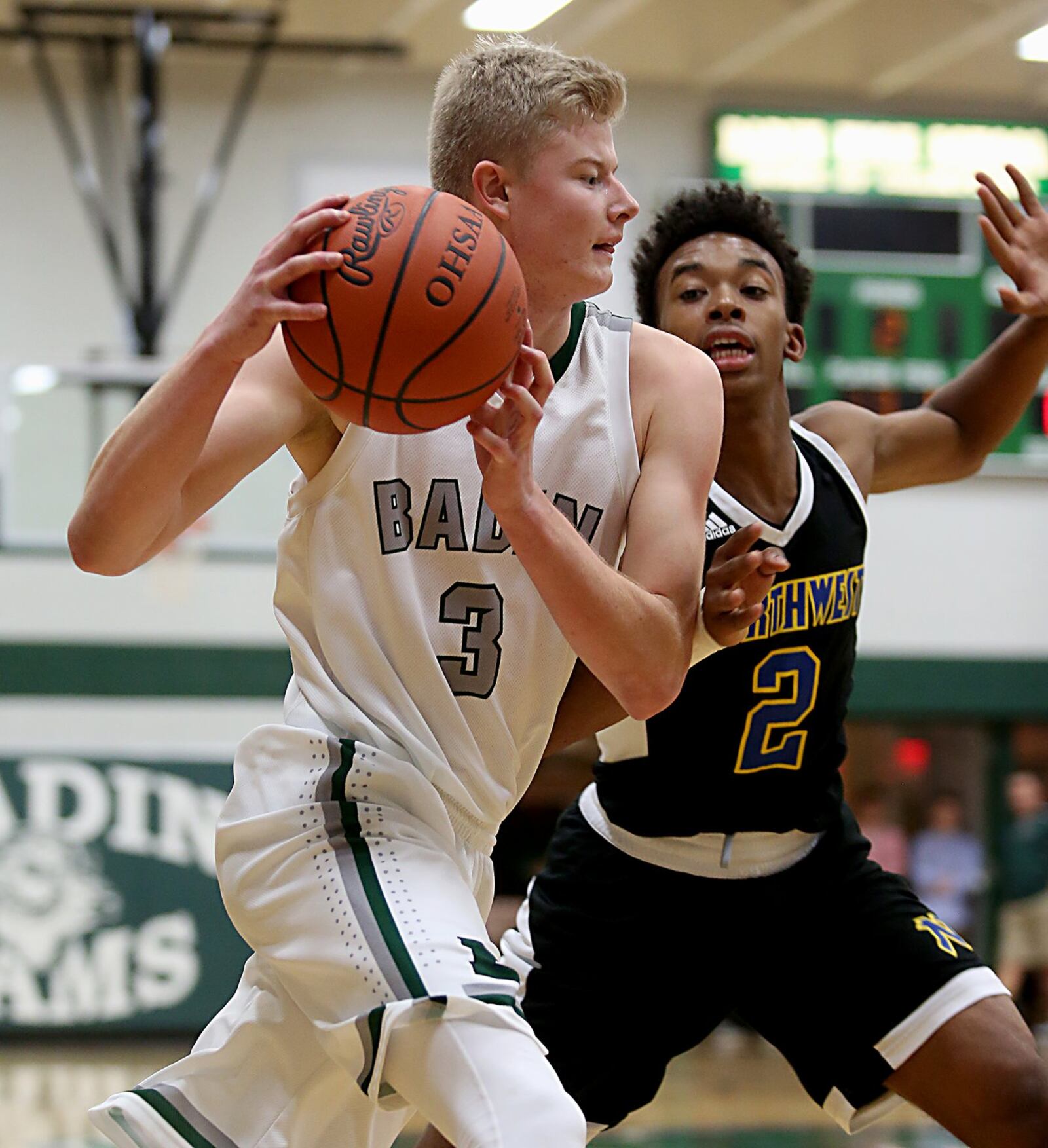 Badin wing Seth Thompson is covered by Northwest guard Greg Jackson on Wednesday night at Mulcahey Gym in Hamilton. CONTRIBUTED PHOTO BY E.L. HUBBARD
