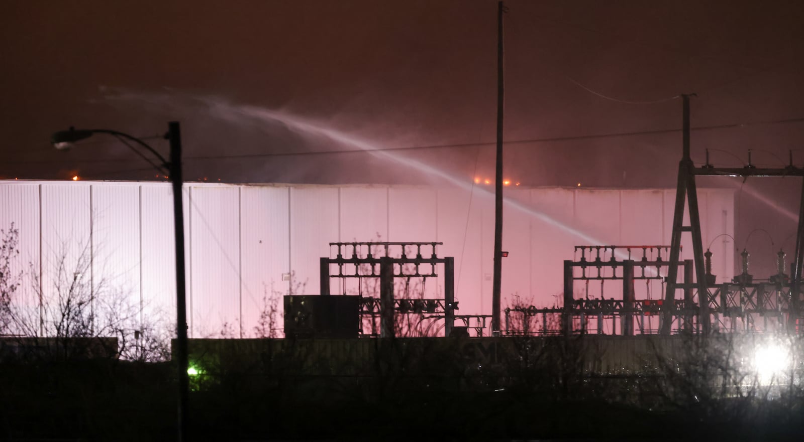 Area firefighters worked to pour water on flames at the Fuyao Glass America plant fire Sunday, March 22, 2026 in Moraine. Bryant Billing / Staff