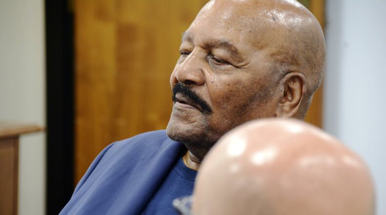 Hall of Fame running back Jim Brown is partnering with Miami University’s Work+ program in order to expand its reach by expanding educational opportunities for the community. Brown is pictured listening to program stakeholders in an Aug. 4, 2019, meeting in downtown Hamilton. MICHAEL D. PITMAN/STAFF