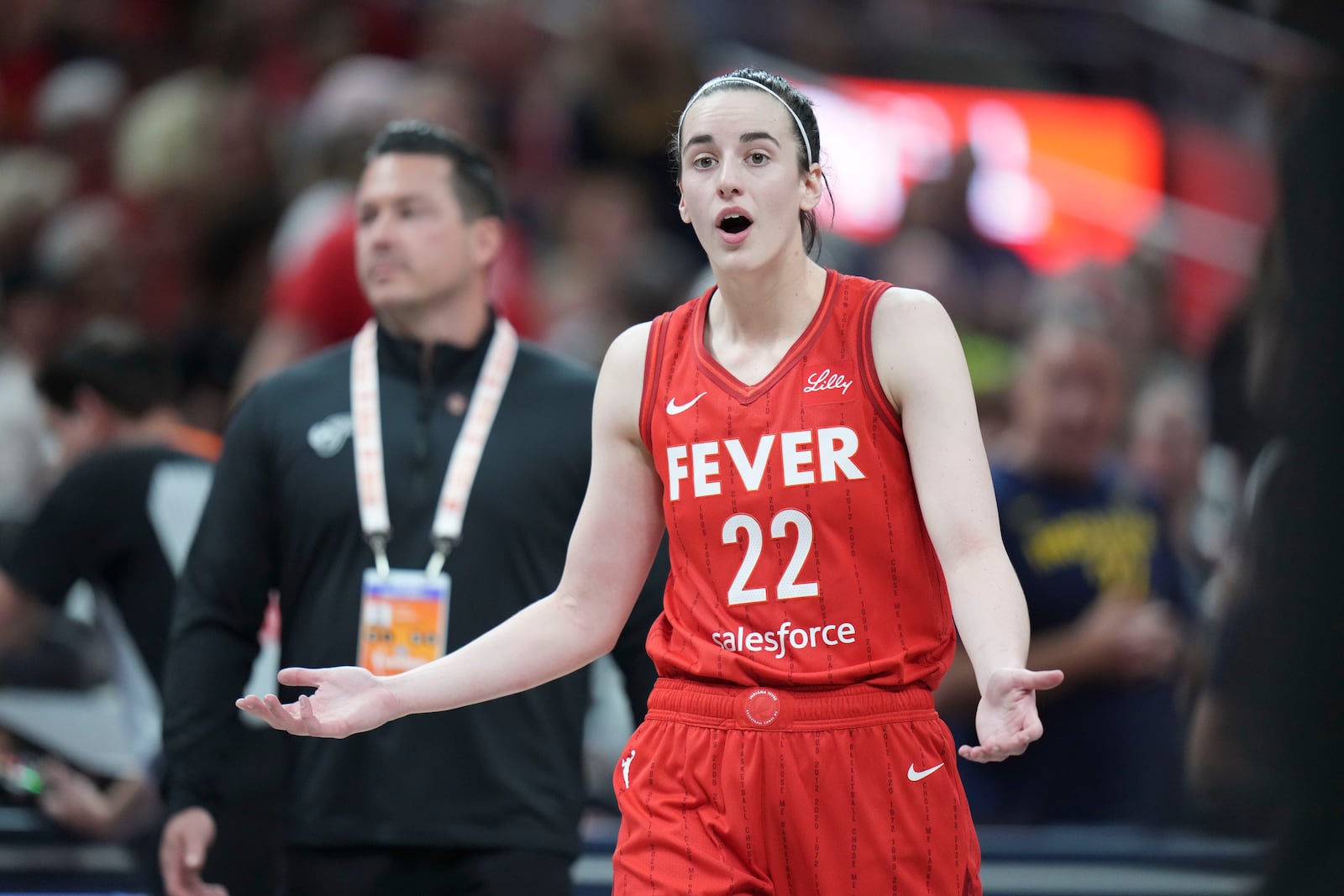 Indiana Fever guard Caitlin Clark (22) reacts after being called for a flagrant foul on Chicago Sky forward Angel Reese during the second half an WNBA basketball game in Indianapolis, Saturday, May 17, 2025. (AP Photo/AJ Mast)