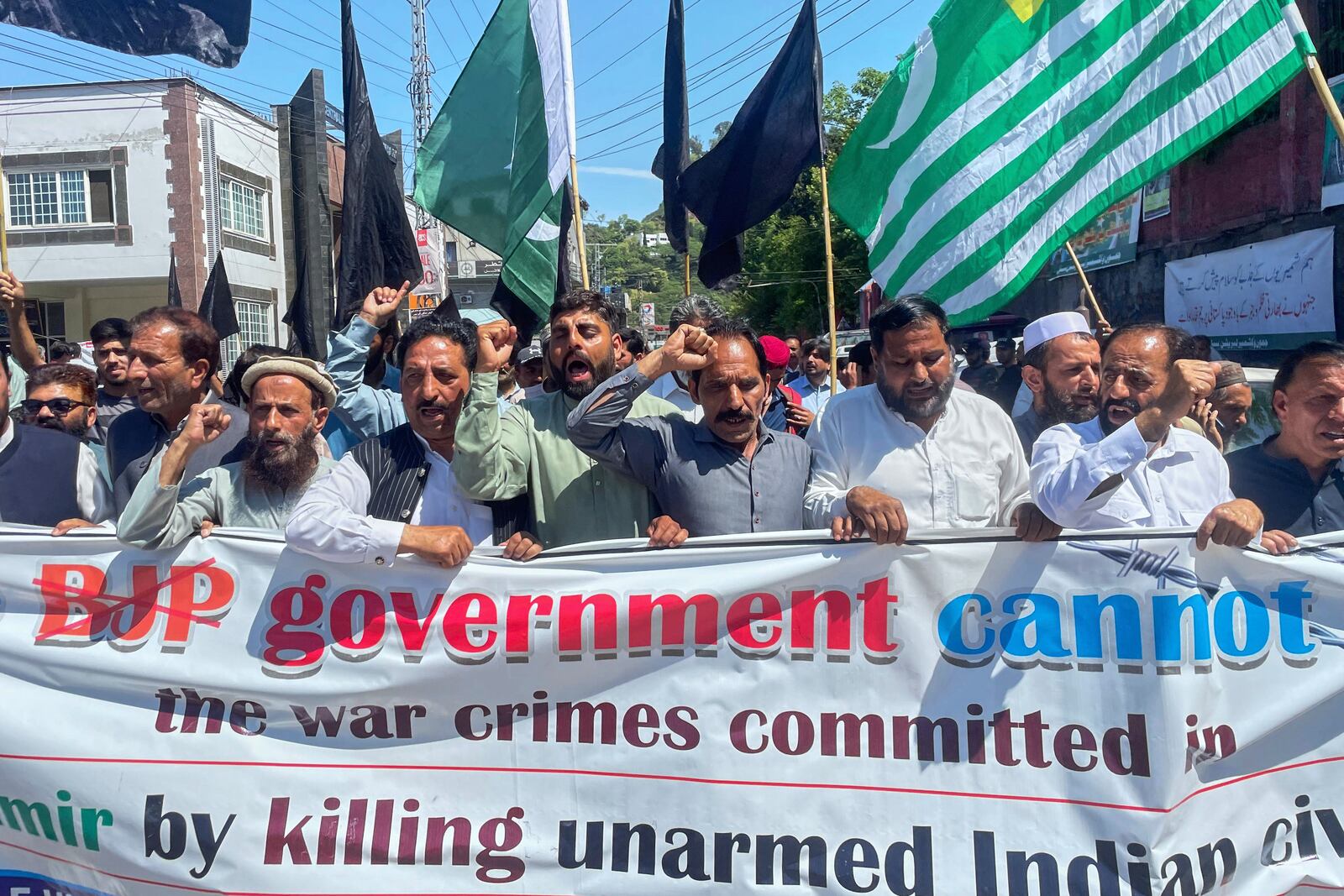 Members of Kashmiri refugee organization "Pasban-e-Hurriya" chant slogans during a demonstration to denounce the suspension of the water sharing treaty by India, in Muzaffarabad, the capital of Pakistan-administered Kashmir, Friday, April 25, 2025. (AP Photo/M.D. Mughal)