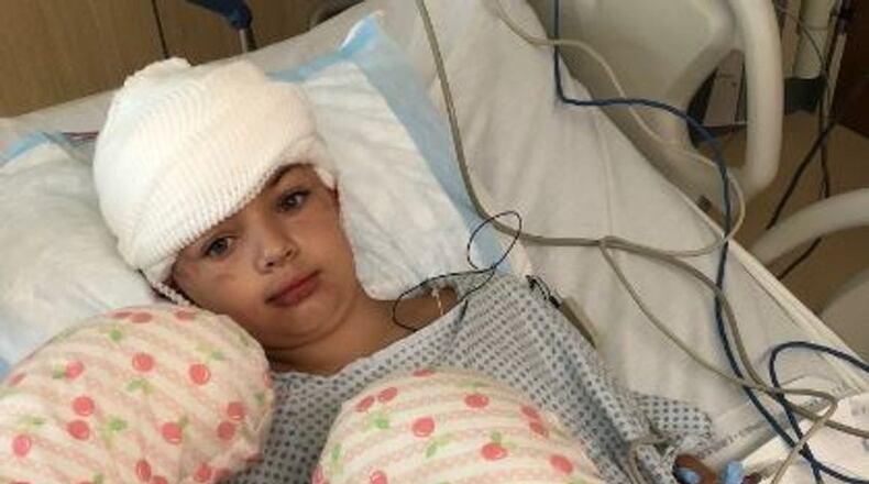 Savannah Coleman sustained head injuries from a dog attack this past weekend in Miami Twp. The dog, which will be euthanized, bit the 8-year-old victim several times on the head, according to police. CONTRIBUTED