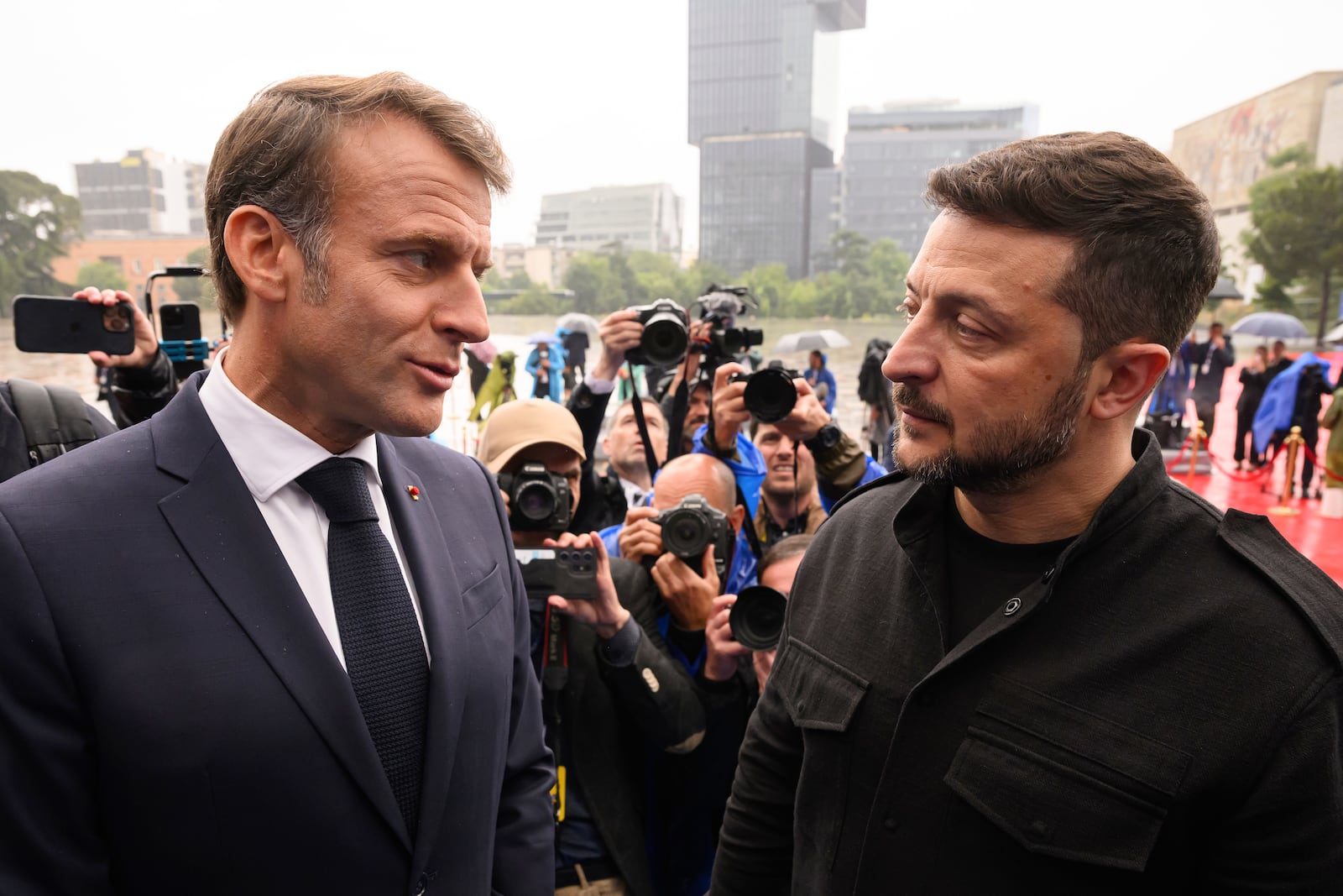 President of France Emmanuel Macron, left, and Ukraine's President Volodymyr Zelenskyy attend a summit where the leaders of 47 European countries and organizations will discuss security, defense and democratic standards, in Tirana, Albania, Friday, May 16, 2025. (Leon Neal/Pool via AP)
