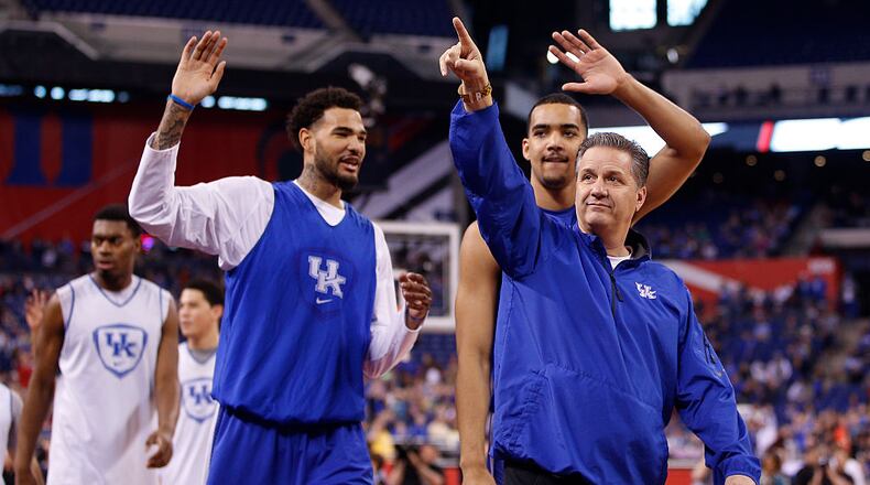 INDIANAPOLIS, IN - APRIL 03: Head coach John Calipari of the Kentucky Wildcats acknowledges the fans with Willie Cauley-Stein #15 and Dakari Johnson #44 during practice for the NCAA Men’s Final Four at Lucas Oil Stadium on April 3, 2015 in Indianapolis, Indiana. (Photo by Joe Robbins/Getty Images)