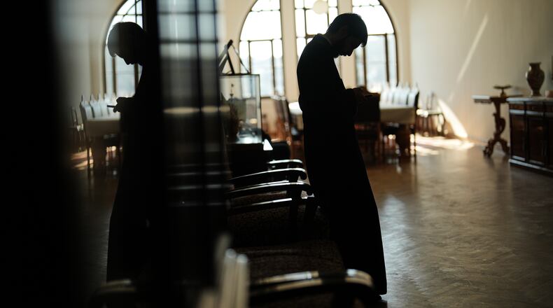 A Christian Orthodox clergy stands in one of the corridors of the Christian Orthodox Halki Theological school, at the Holy Trinity monastery, in Heybeliada island, Istanbul, Turkey, Friday, Nov. 14, 2025. (AP Photo/Francisco Seco)