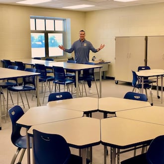 Later this week, a new wing of classrooms will be unveiled to teachers at Monroe Junior and Senior High School helping to soon bring some overcrowding relief in the fast-growing school system. Last year, Monroe school officials decided to undertake a rare building renovation by beginning construction work to convert a junior high gym into 8 new classrooms in two stories along with two smaller, learning conference rooms. Pictured is Monroe Jr. High Principal Logan Stanger in one of the new classrooms. (Photo By Michael D. Clark/Journal-News)