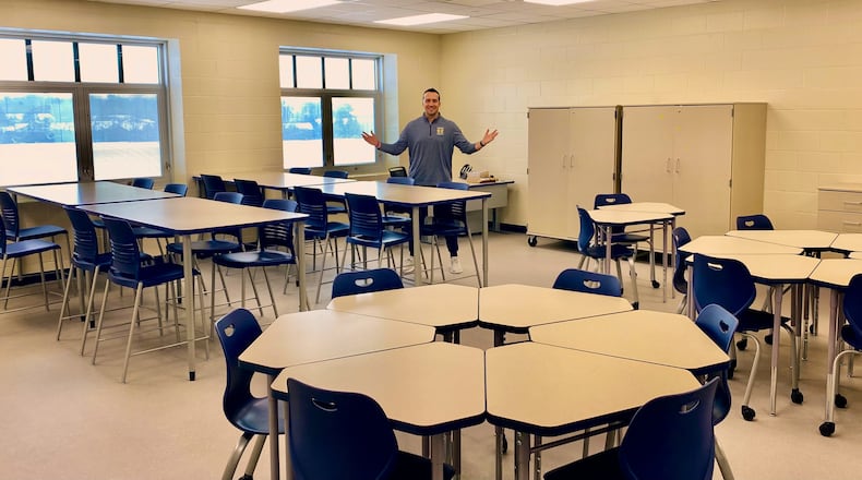 Later this week, a new wing of classrooms will be unveiled to teachers at Monroe Junior and Senior High School helping to soon bring some overcrowding relief in the fast-growing school system. Last year, Monroe school officials decided to undertake a rare building renovation by beginning construction work to convert a junior high gym into 8 new classrooms in two stories along with two smaller, learning conference rooms. Pictured is Monroe Jr. High Principal Logan Stanger in one of the new classrooms. (Photo By Michael D. Clark/Journal-News)