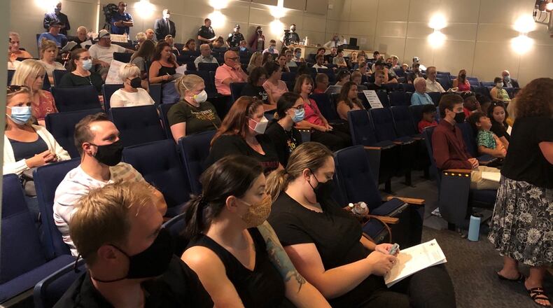 About 100 people attended the Tuesday, Aug. 24, 2021, Kettering school board meeting, when Superintendent Scott Inskeep was to make a recommendation all students and staff wear masks amid a rising number of COVID-19 cases and required quarantines during the first couple weeks of school. Nick Blizzard/Staff