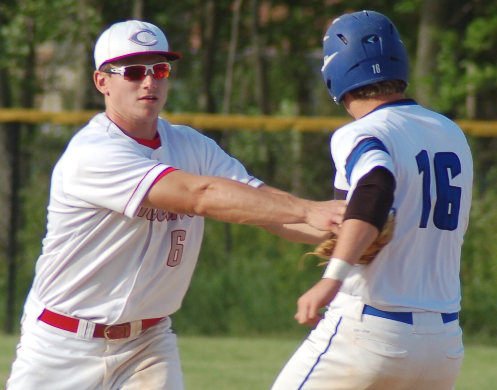 Carlisle shortstop Caleb Boy puts the tag on Brookville’s Nick O’Meara at second base during the Indians’ 8-0 win in a Division III sectional final at Northmont on May 17. JOHN CUMMINGS / CONTRIBUTED