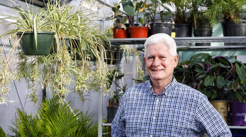 Steve Timmer, executive director of Hamilton Parks Conservancy, stands inside a greenhouse the Conservancy uses to grow plants that will be installed around Hamilton in various parks. Timmer is retiring but will likely continue to help with projects. NICK GRAHAM / STAFF