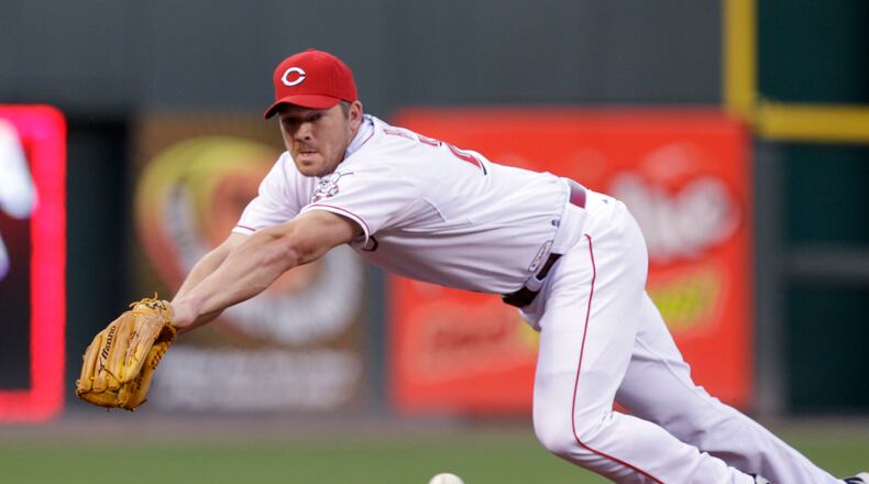 FILE - Cincinnati Reds third baseman Scott Rolen fields a ball hit by the Arizona Diamondbacks in a baseball game Sept. 14, 2010, in Cincinnati. Rolen was elected to baseball's Hall of Fame, in voting announced Tuesday, Jan. 24, 2023. (AP Photo/Al Behrman, File)