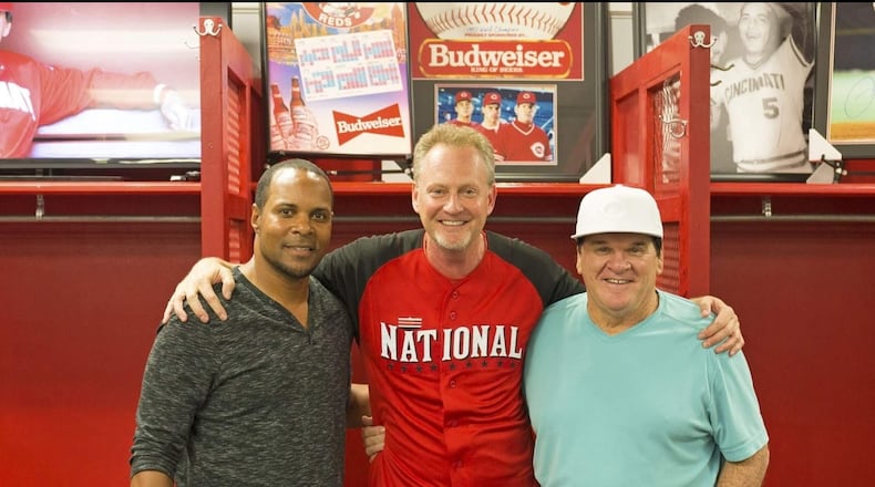 Barry Larkin and Pete Rose, two all-time Cincinnati Reds greats, appeared at Sports Gallery in 2016 for a public signing. Sports Gallery is owned by Mark Fugate, middle. The store is temporarily closed and all player signings postponed due to the coronavirus. SUBMITTED PHOTO