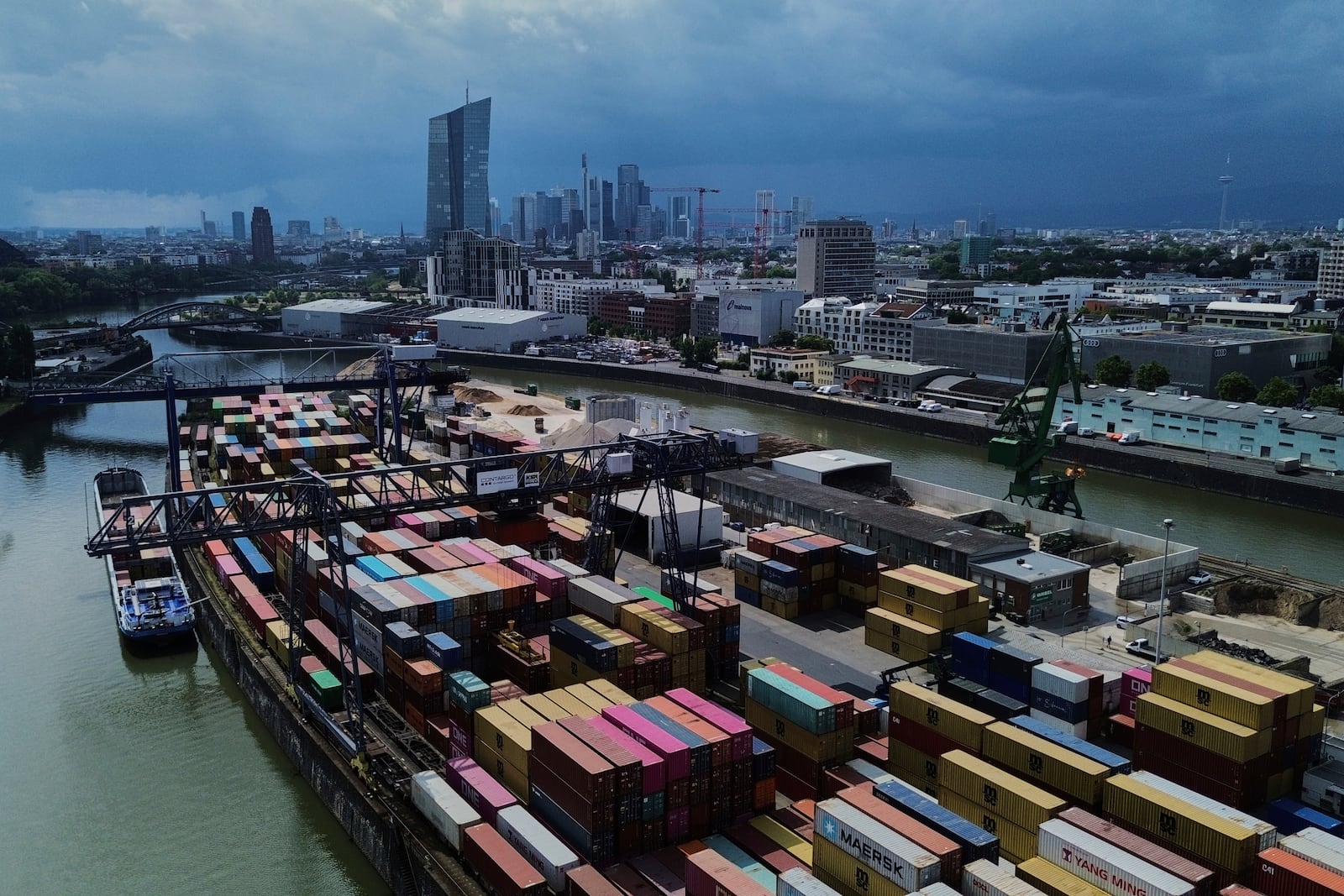Containers are piled in a cargo terminal in Frankfurt, Germany, Monday, July 14, 2025. (AP Photo/Michael Probst)