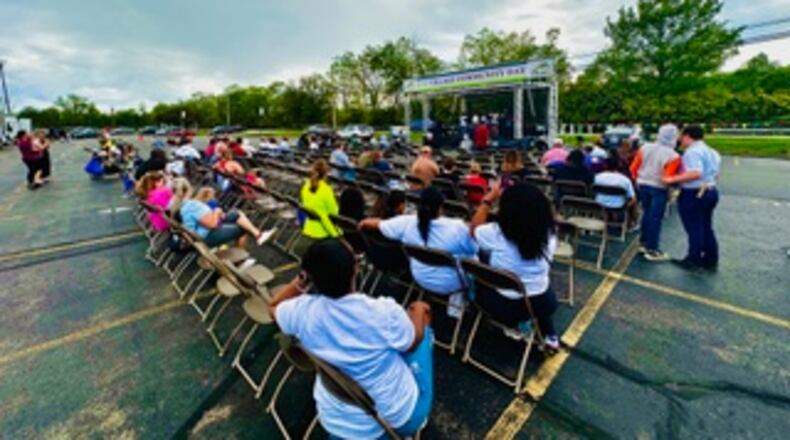 More than 300 people attended the May 4 One Village Community Day and Health Fair at the New Miami School. The event included free health screenings from Premier Health, representatives from about 30 community partners and free food. CONTRIBUTED