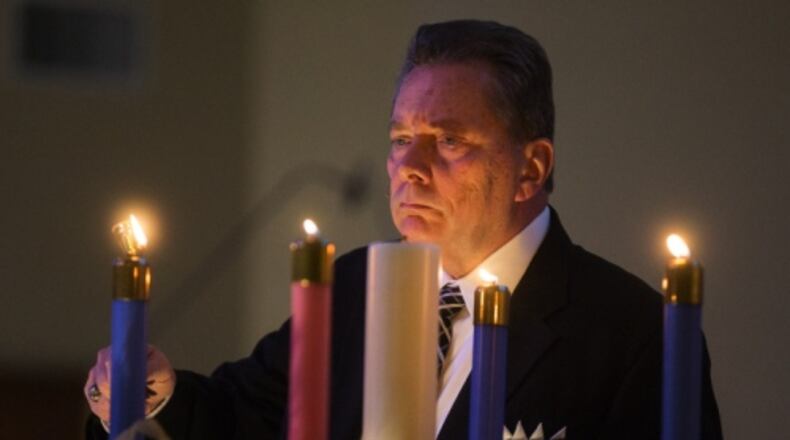 Churches across across the country are increasingly offering separate 'Blue Christmas' services for congregants and others facing struggles. (Leah Klafczynski/Akron Beacon Journal)