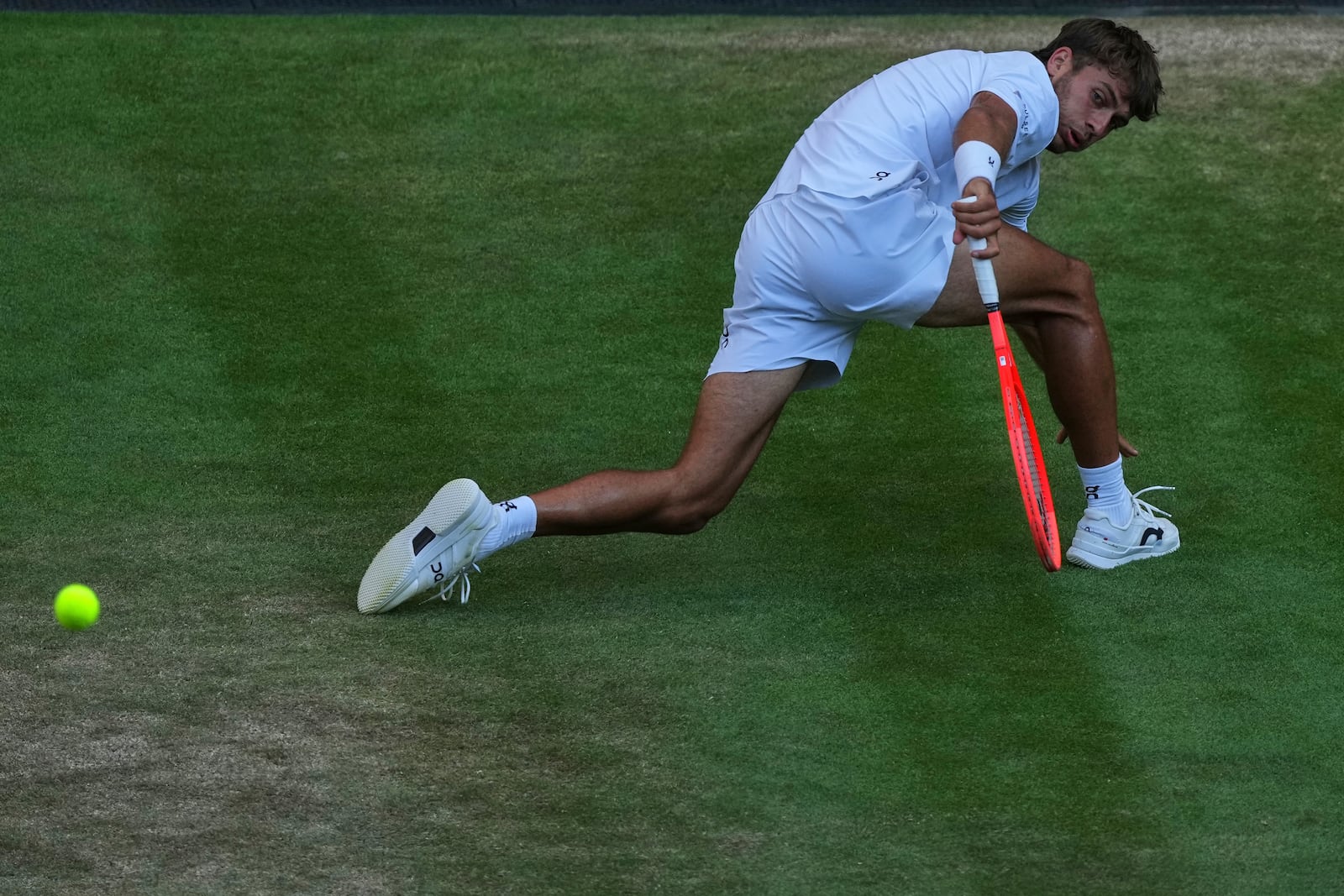 Italy's Flavio Cobolli returns to Serbia's Novak Djokovic during a quarterfinal men's singles match at the Wimbledon Tennis Championships in London, Wednesday, July 9, 2025. (AP Photo/Joanna Chan)