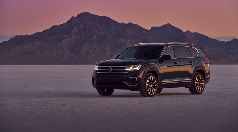 This photo provided by Volkswagen shows the 2021 Atlas, which is quiet and comfortable on the road. It also has the lowest starting price among three-row midsize SUVs. (Courtesy of Volkswagen of America via AP)