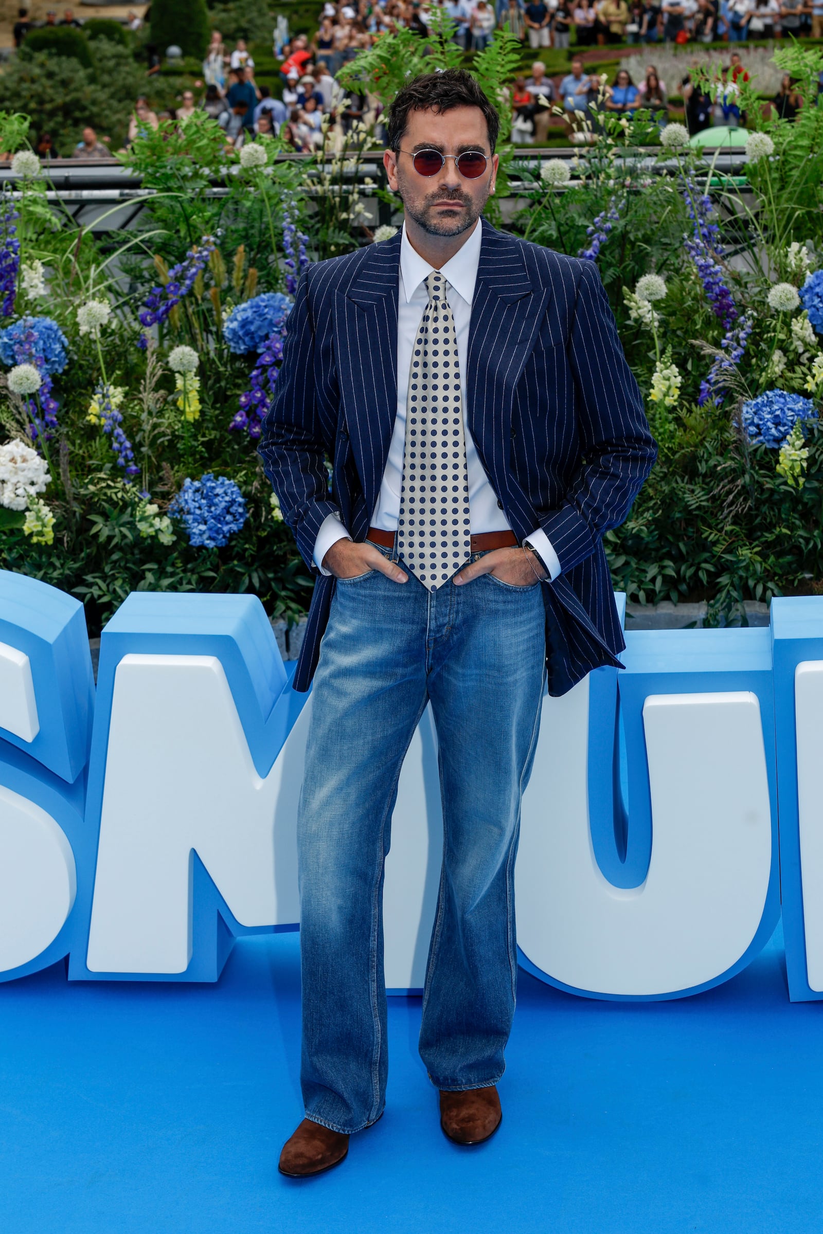 Dan Levy poses for photographers upon arrival at the world premiere of the film "Smurfs", on Saturday, June 28, 2025, in Brussels. (AP Photo/Omar Havana).