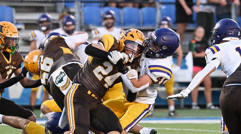 Alter High School senior Noah Jones collides with Bellbrook sophomore Jayce Spencer during their game on Friday, Sept. 19 at Miamisburg High School's Holland. The Knights won 21-3. NICK FALZERANO / CONTRIBUTED PHOTO