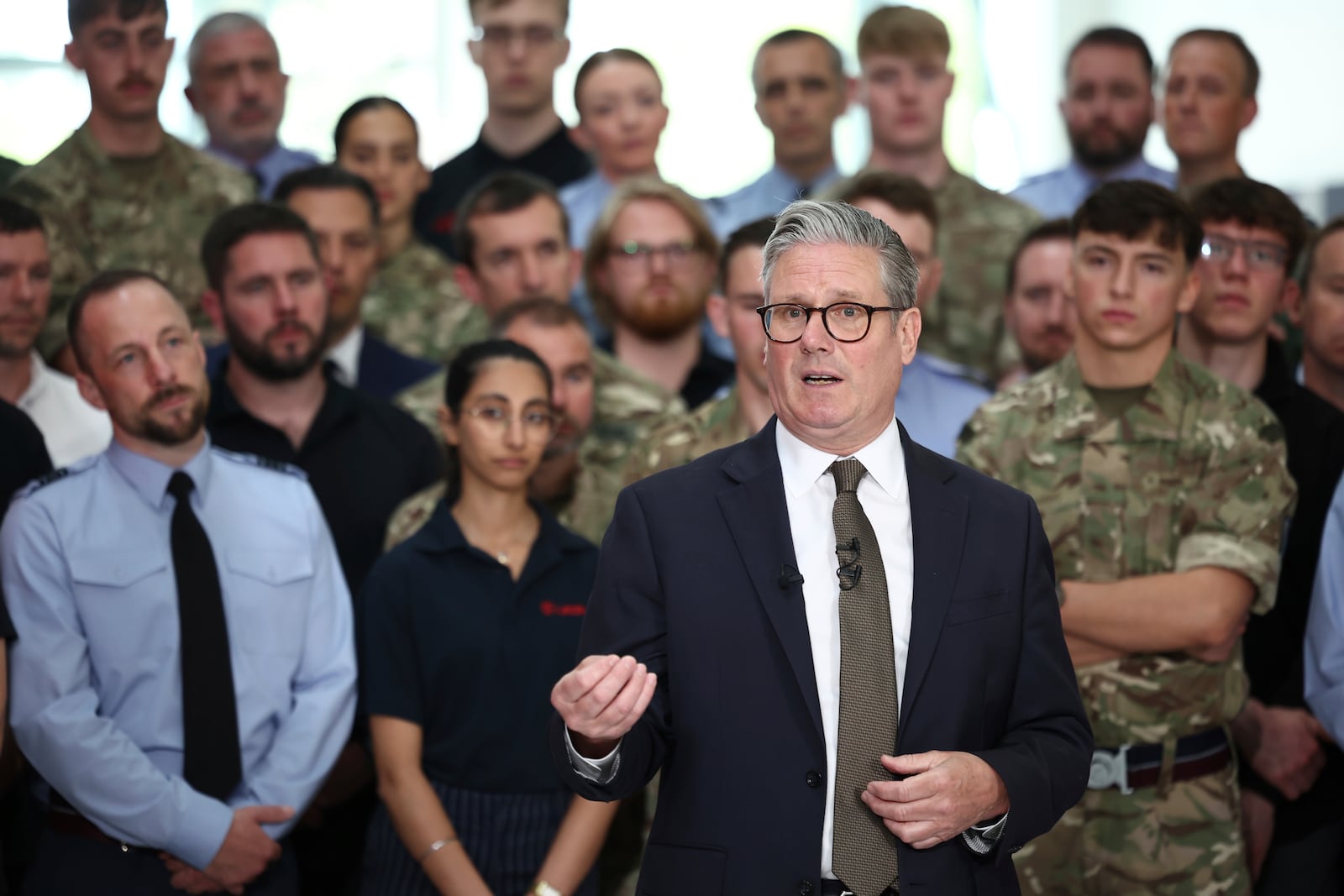 Britain's Prime Minister Keir Starmer speaks to members of staff during a visit to Leonardo, one of the biggest suppliers of defence and security equipment to the UK MOD, in Luton, England, Friday, May 2, 2025. (Henry Nicholls/Pool Photo via AP)