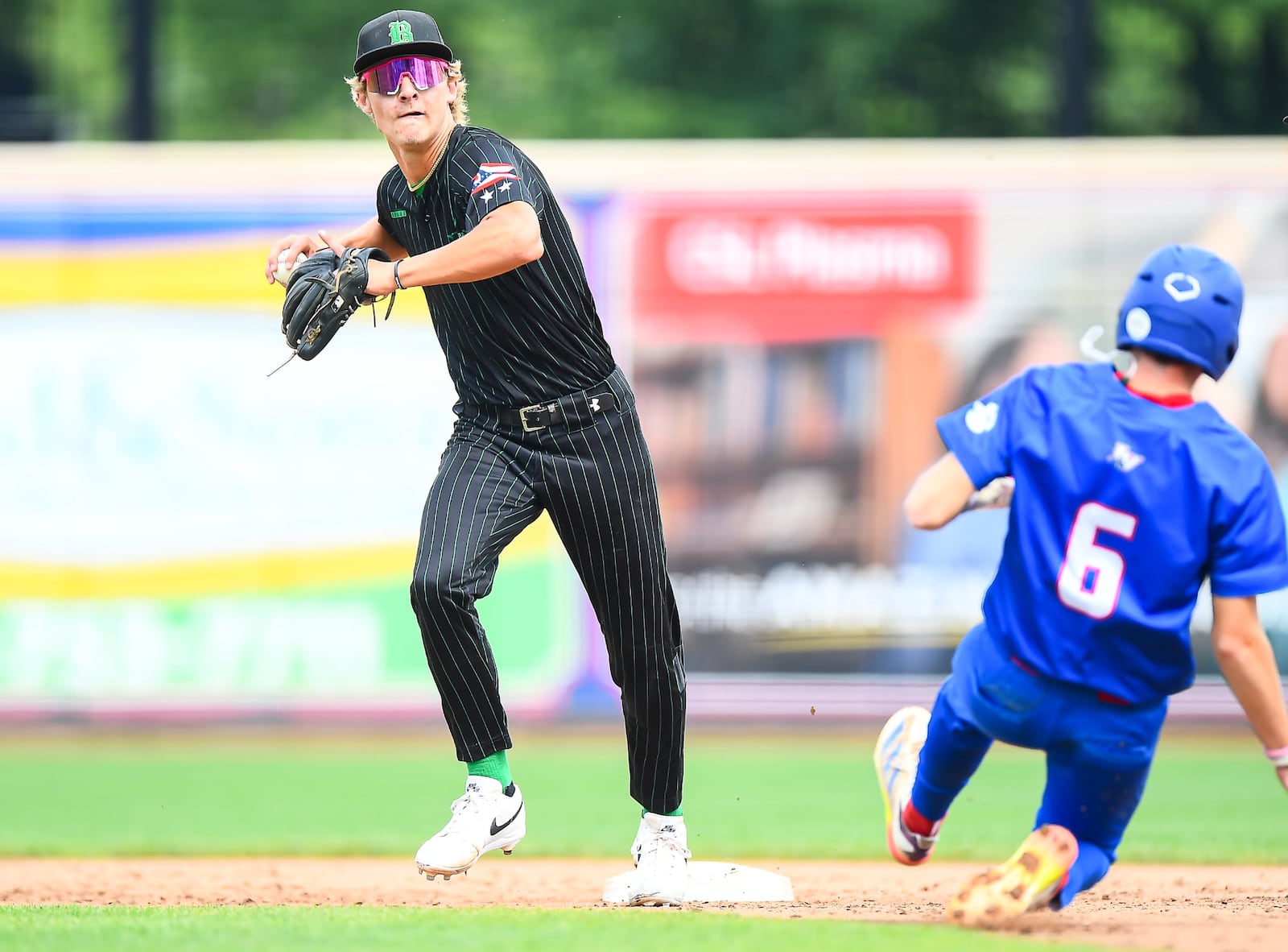 Badin shortstop Cooper Ollis makes an unassisted double play during his Division III state semifinal game against Licking Valley on Friday at Canal Park in Akron. KYLE HENDRIX / CONTRIBUTED