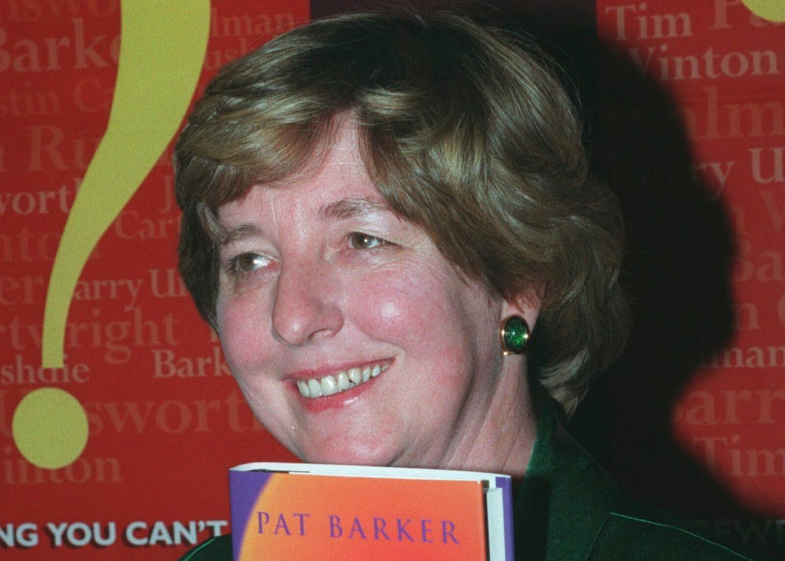 FILE - English novelist Pat Barker holds her latest book, "The Ghost Road", in London Tuesday night Nov. 7 1995 just after the announcement that it had won her the 1995 Booker Prize. (AP Photo/Max Nash, file)