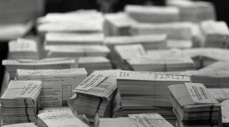 Paper voting ballots are stacked to be counted at Butler County Board of Elections on Nov. 8, 1988.