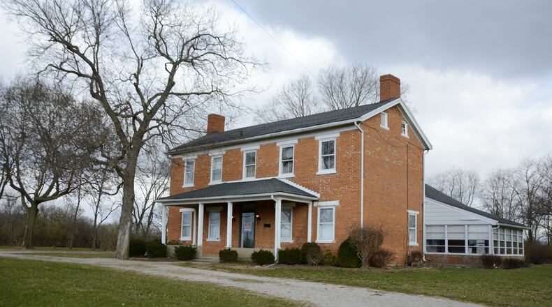 A group of residents want to save the 1824-era home known as the Cooper house that’s on the former Muskopf property the city purchased earlier this year. The city’s initial intent was to raze the building but the group of residents want to save the house and turn it into an educational opportunity. MICHAEL D. PITMAN/STAFF