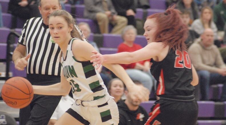 Badin sophomore Gracie Cosgrove (left) is guarded by Franklin senior Addie Lloyd during their Division II sectional contest on Wednesday night at Middletown. The Rams won 71-6. Chris Vogt/CONTRIBUTED