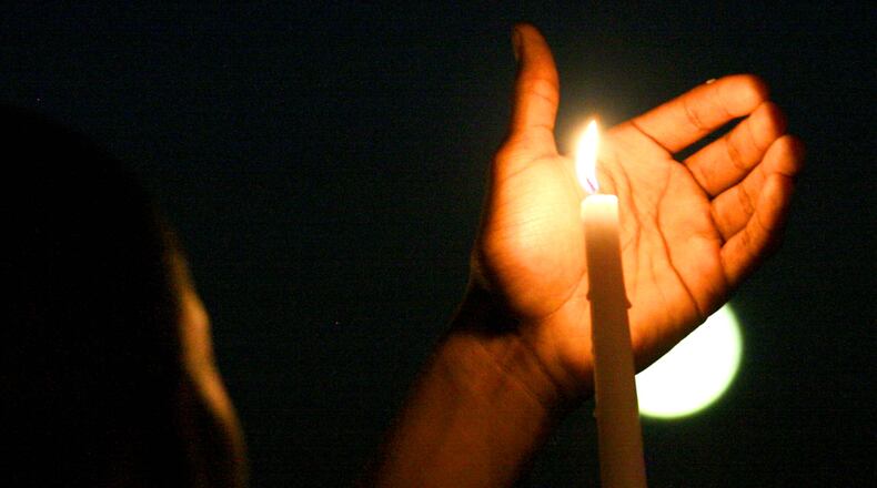 Butler County community leaders are holding a community candlelight vigil tonight, Aug. 18, to honor those killed and injured last weekend in Charlottesville, Va. STAFF FILE PHOTO