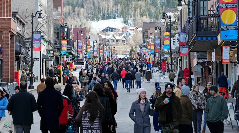 Pedestrians walk down Main Street on the first day of the 2026 Sundance Film Festival on Thursday, Jan. 22, 2026, in Park City, Utah. (Photo by Charles Sykes/Invision/AP)