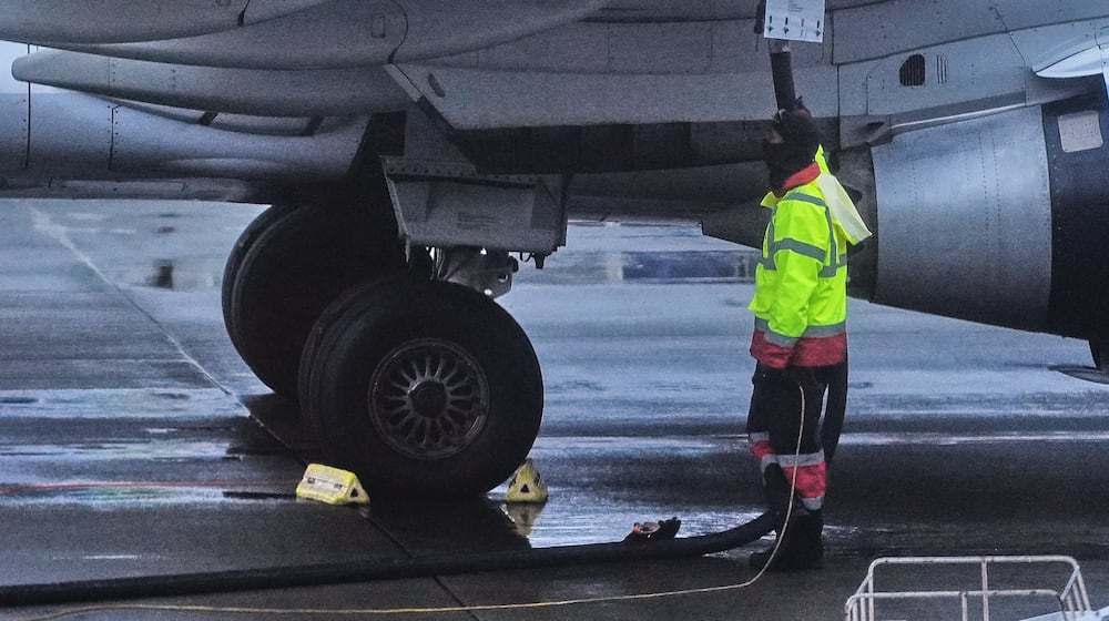 FILE - An airplane is refueled at Seattle-Tacoma International Airport in SeaTac, Wash., on Sunday, Nov. 23, 2025. (AP Photo/Lindsey Wasson, File)